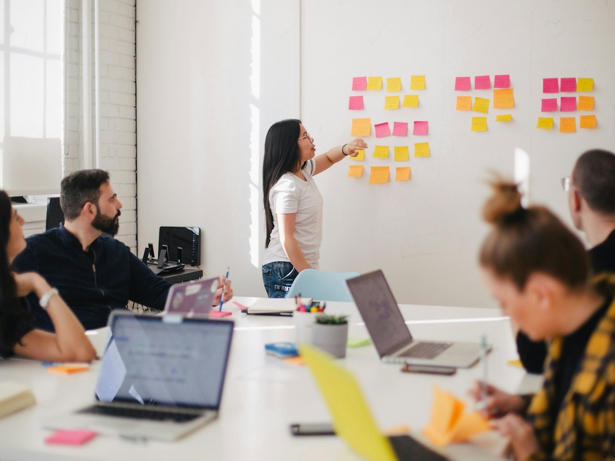 Planning session with sticky notes on a whiteboard