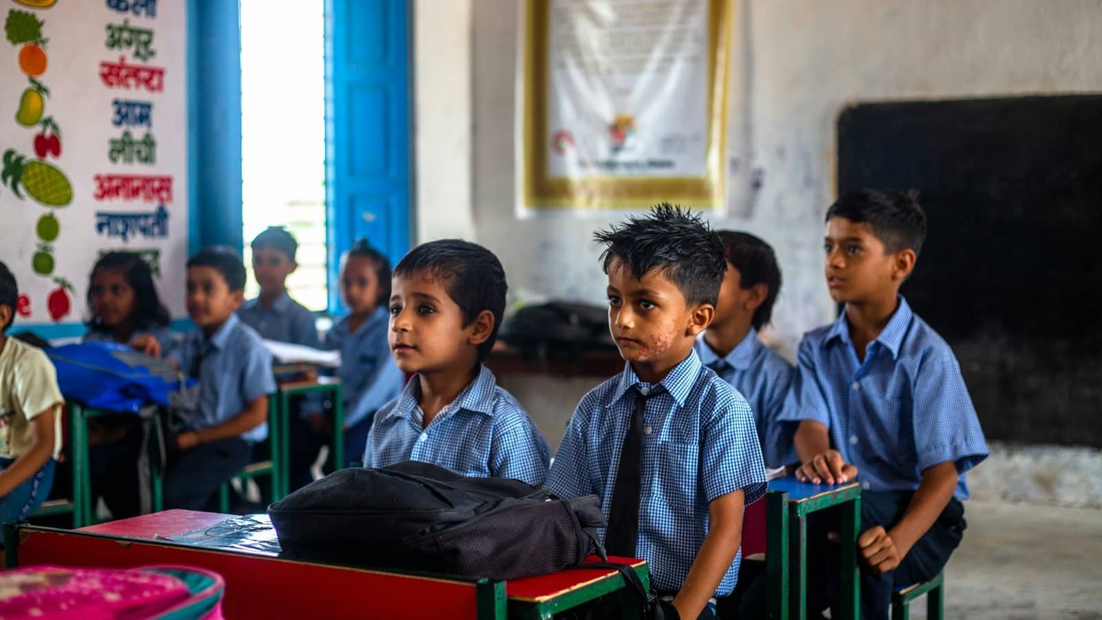 Children at desks in a learning centre