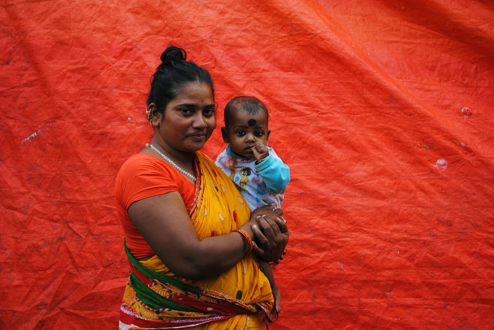 A mother holding her infant